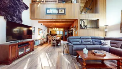 a living room with a couch and a tv at Winterset #3 condo in Mammoth Lakes