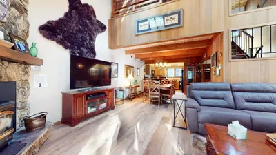 a living room with a couch and a tv at Winterset #3 condo in Mammoth Lakes