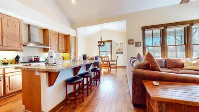 a kitchen and living room with a couch at Snowcreek VI The Lodges #1167 condo in Mammoth Lakes