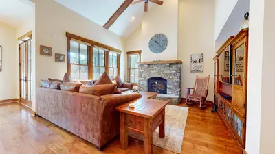 a living room with a couch and a fireplace at Snowcreek VI The Lodges #1167 condo in Mammoth Lakes