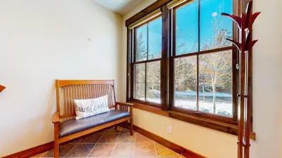 a bench in a room with a window at Snowcreek VI The Lodges #1167 condo in Mammoth Lakes