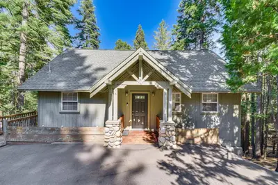 a home in the woods with a driveway at Cold Springs Mountain Cabin Hot Tub and Generator in Cold Springs
