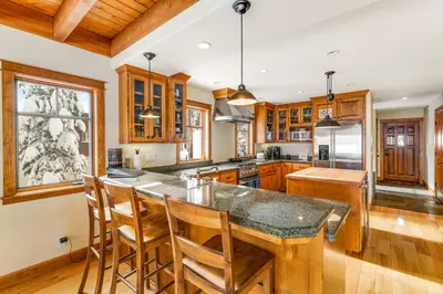 a kitchen with wooden cabinets and a large island at Cabin in Soda Springs in Soda Springs