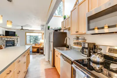 a kitchen with a sink and a refrigerator at 2 Mi to Heavenly Mtn Resort Retreat with Sauna! in Stateline