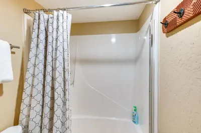 a bathroom with a shower with a shower curtain at 2 Mi to Heavenly Mtn Resort Retreat with Sauna! in Stateline