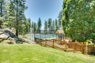 a fence with a tennis court in a yard at 2 Mi to Heavenly Mtn Resort Retreat with Sauna! in Stateline