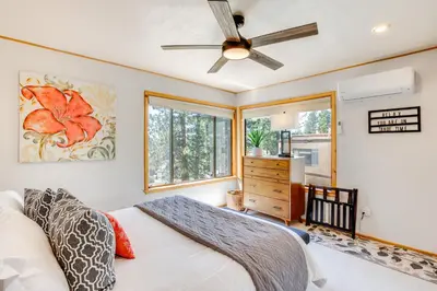 a bedroom with a bed and a ceiling fan at 2 Mi to Heavenly Mtn Resort Retreat with Sauna! in Stateline