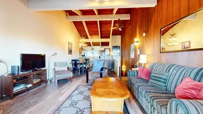 a living room with a couch and a table at Mammoth Point #106 condo in Mammoth Lakes