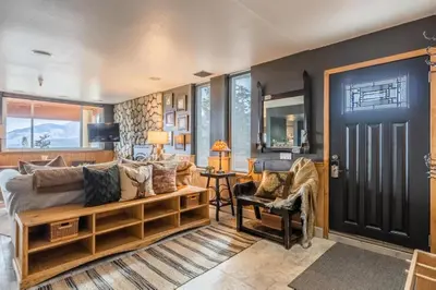 a living room with a couch and a table at Bridges 112 in Mammoth Lakes