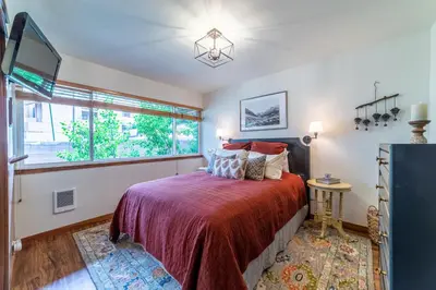 a bedroom with a bed and a window at Mammoth Estates 210 in Mammoth Lakes