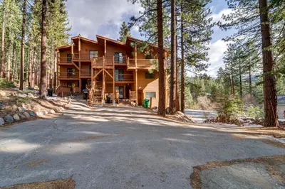 a large house in the middle of a forest at Less Than 3 Mi to Lake Tahoe Incline Village Condo! in Incline Village