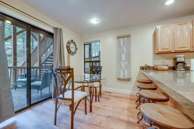 a kitchen and dining room with a table and chairs at Less Than 3 Mi to Lake Tahoe Incline Village Condo! in Incline Village