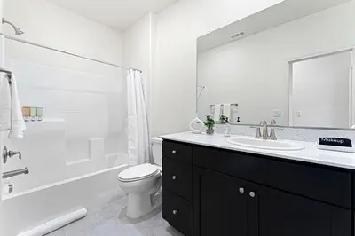 a bathroom with a sink and a toilet and a shower at Stylish 4BR Home Nr Golden Eagle Sports Complex in Sparks