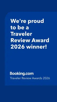 a blue sign that says were proud to be a traveler reviewagency winner at Cozy Sequoia Forest Cabin near Lake Isabella in Wofford Heights