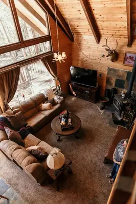 an overhead view of a living room with a couch and a television at Cozy Sequoia Forest Cabin near Lake Isabella in Wofford Heights