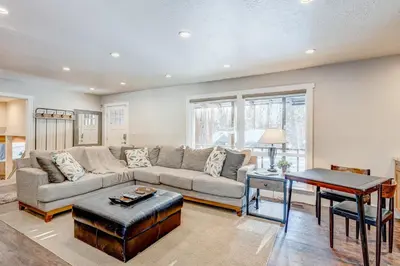 a living room with a couch and a table at Comfort is Key Cabin in Incline Village
