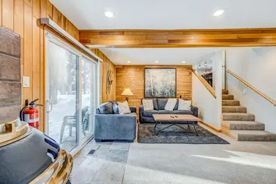 a living room with a couch and a table at Comfort is Key Cabin in Incline Village