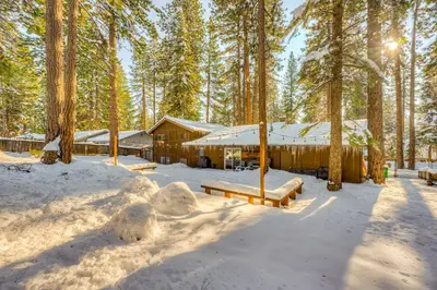 a cabin in the woods in the snow at Comfort is Key Cabin in Incline Village