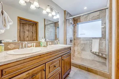 a bathroom with a sink and a shower at Comfort is Key Cabin in Incline Village