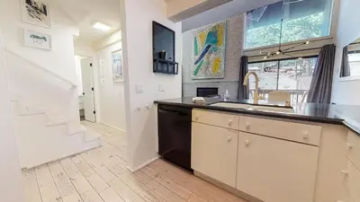 a kitchen with a sink and a counter top at Walk to Canyon Lodge! Ski back! Modern Space in Mammoth Lakes