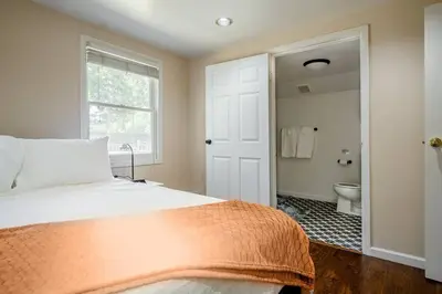 a bedroom with a bed and a bathroom with a toilet at *2bdr Victorian Home away from Home - *Central Loc in Sacramento