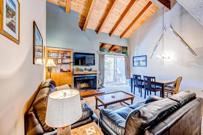 a living room with a couch and a table at Lake Tahoe Leisure in Carnelian Bay