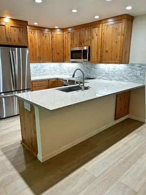 a kitchen with wooden cabinets and a sink at Lake Tahoe Leisure in Carnelian Bay