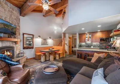 a living room with a couch and a fireplace at Cozy Northstar Village Family Condo Walk to Lifts 2 Full BA Excellent Location in Truckee