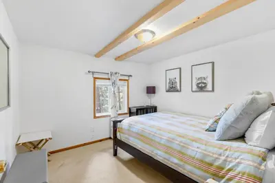 a bedroom with a bed and a window at Vacation Valhalla in Arnold