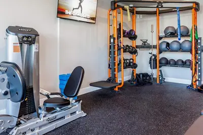 a room with a gym with weights and equipment at Designer Apt w Jacuzzi Walk To Casino & iMax in Sparks