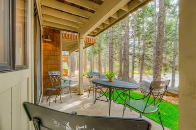 a patio with a table and chairs on a porch at Crystal Bay Comfort in Incline Village
