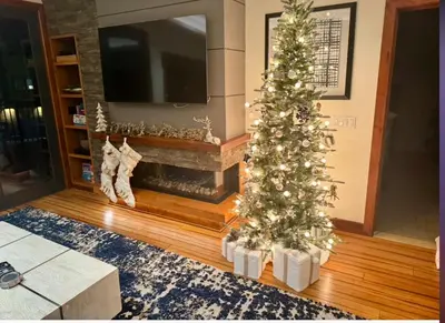 a living room with a christmas tree and a fireplace at Ski In/Out - Zalanta - Great Location- 2 Hot Tubs - Heated Pool in South Lake Tahoe