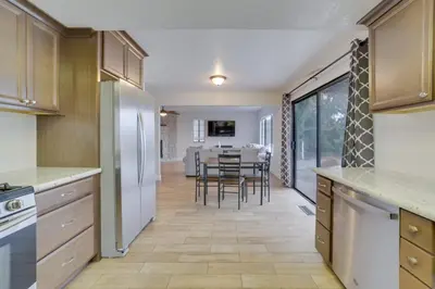 a kitchen and dining room with a table and chairs at Pet-Friendly Hollister Getaway with Grill! in Hollister