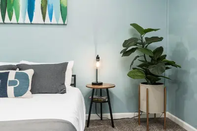 a bedroom with a bed and a potted plant at Mountain View, Hot Tub, Open Kitchen, 10m to Sequoia in Three Rivers