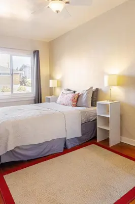 a bedroom with a large bed and a window at Midcentury Gem in Midtown Reno in Reno