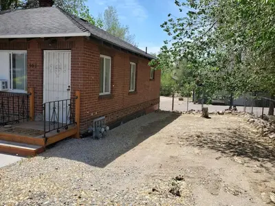 a brick house with a white door and a porch at Midcentury Gem in Midtown Reno in Reno