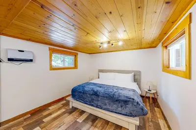 a bedroom with a bed and a wooden ceiling at The Chalet at Kings Beach 9 in Kings Beach