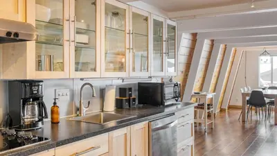 a kitchen with a sink and a microwave at Chickaree Chickadee Buyout by AvantStay 2 Sister Cabins in Tahoe City