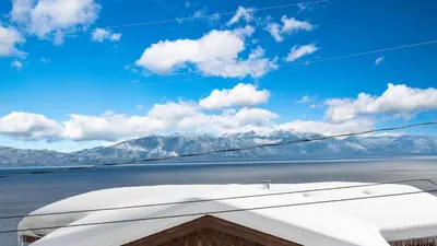 a view of the mountains from the wing of an airplane at Chickaree Chickadee Buyout by AvantStay 2 Sister Cabins in Tahoe City