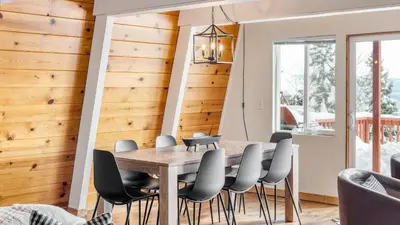 a dining room with a table and chairs at Chickadee by AvantStay Modern A-Frame Cabin in Tahoe City