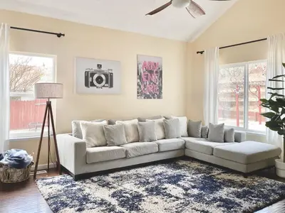 a living room with a white couch and two windows at Reno Gem 3 and a half Miles to DT, 40 Miles to Tahoe in Reno