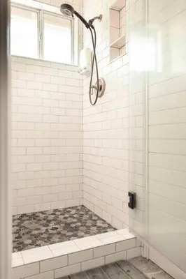a white bathroom with a shower with a window at Relax at Yosemite, Cozy House with King Bed, Private Hot Tub & Fast Wi-Fi, Near town in Oakhurst