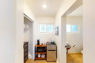 a small kitchen with a refrigerator in a room at The Chalet at Kings Beach Unit 2 in Kings Beach