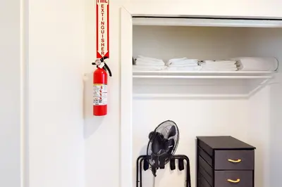 a fire extinguisher hanging on the door of a closet at The Chalet at Kings Beach Unit 2 in Kings Beach