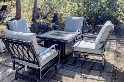a group of three chairs sitting next to a grill at The Chalet at Kings Beach Unit 2 in Kings Beach