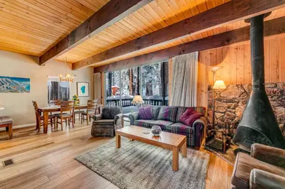 a living room with a couch and a fireplace at Fairway Forest in Incline Village