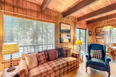 a living room with a couch and a chair at Talmont Trailhead Cabin in Tahoe City