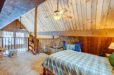 a bedroom with a bed and a ceiling fan at Lofty Lodi in South Lake Tahoe