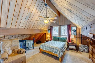 a bedroom with a bed and a ceiling fan at Lofty Lodi in South Lake Tahoe