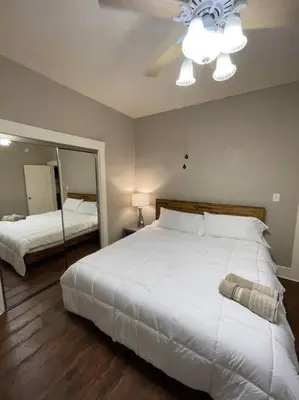 a bedroom with two beds and a ceiling fan at 2 King Beds! Fantastic Stylish Bungalow home! in Fresno